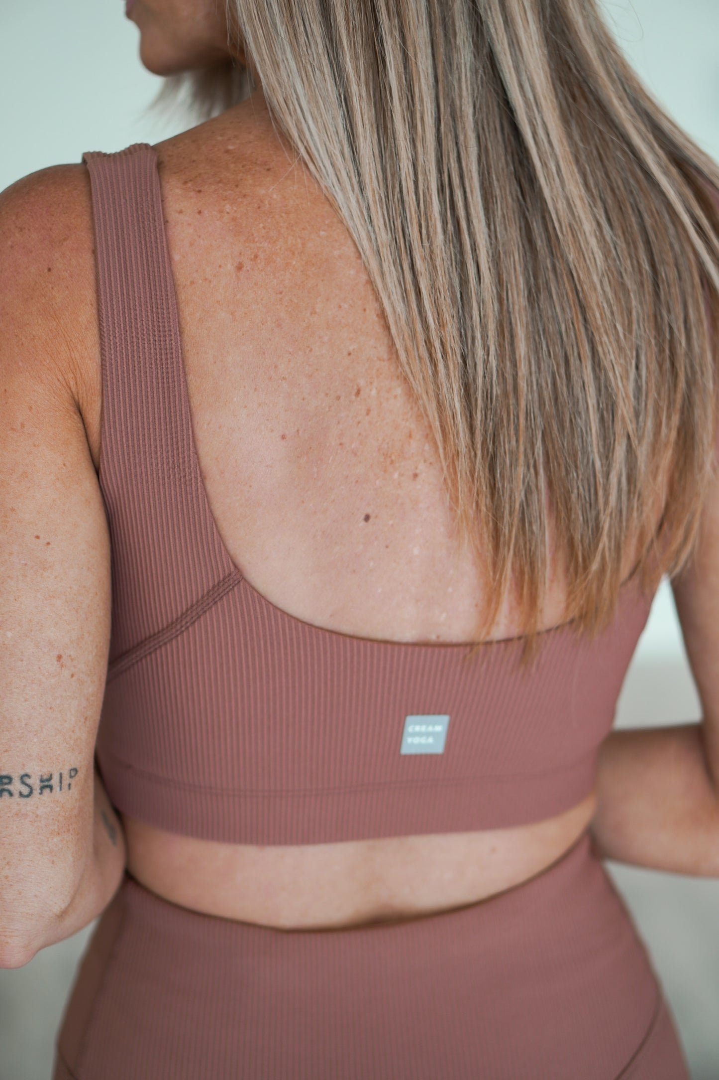 Showing an up close of the rose colored bra tank top