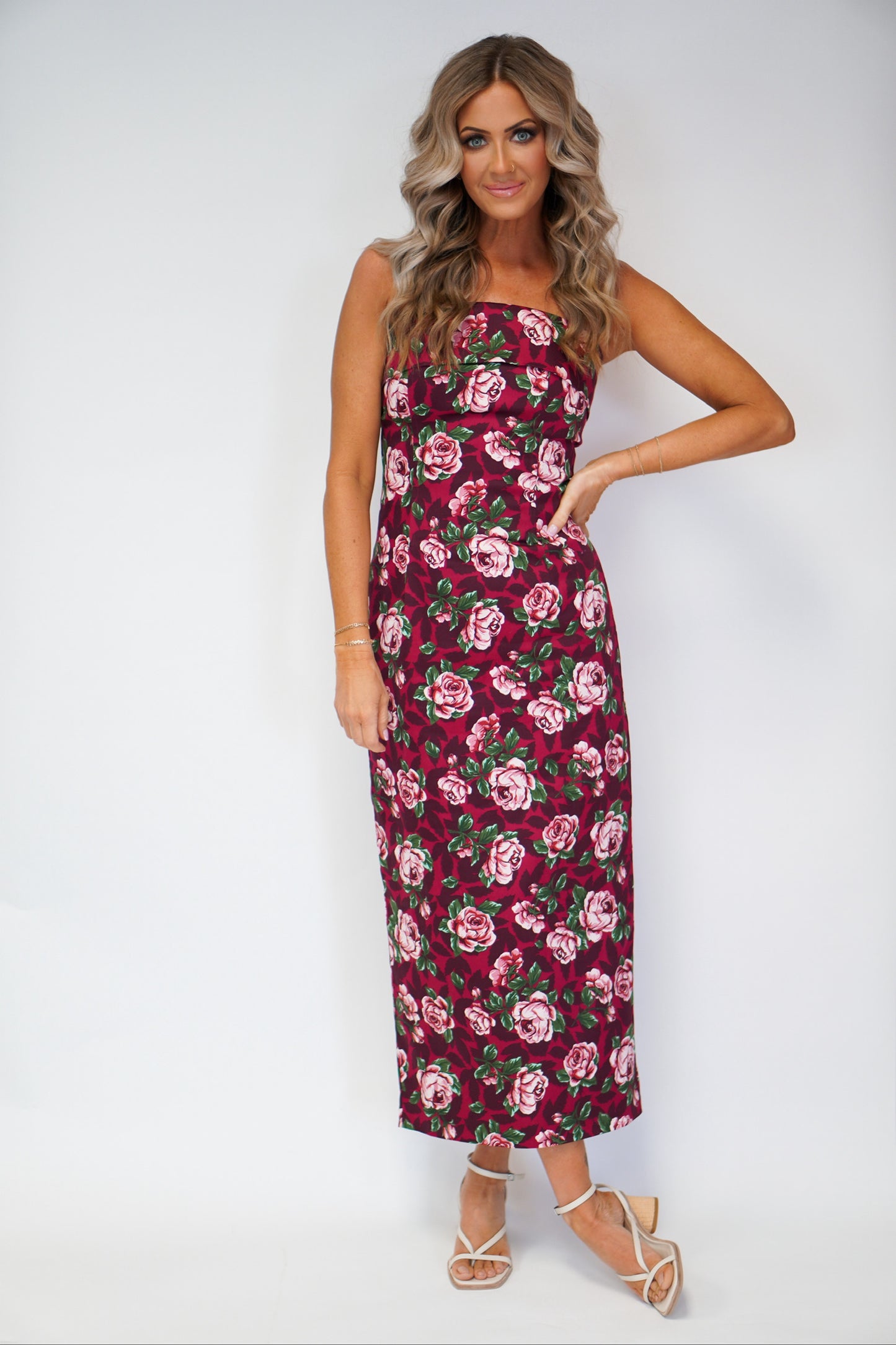 girl wearing tube dress with floral detail maxi style with hand on hip