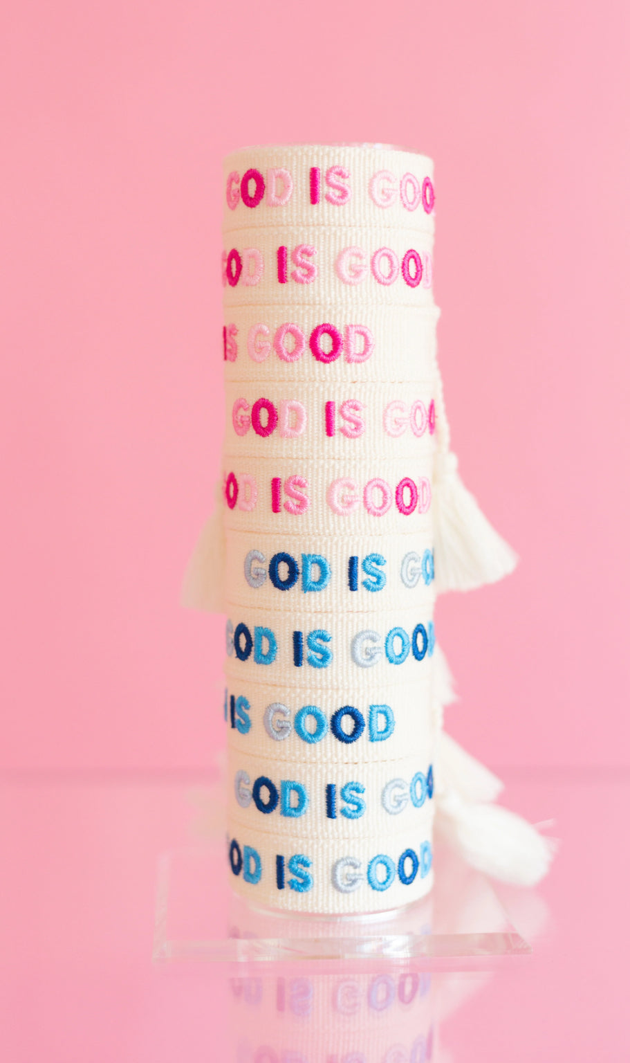 God is good blue god is good pink bracelets on bracelet stand 