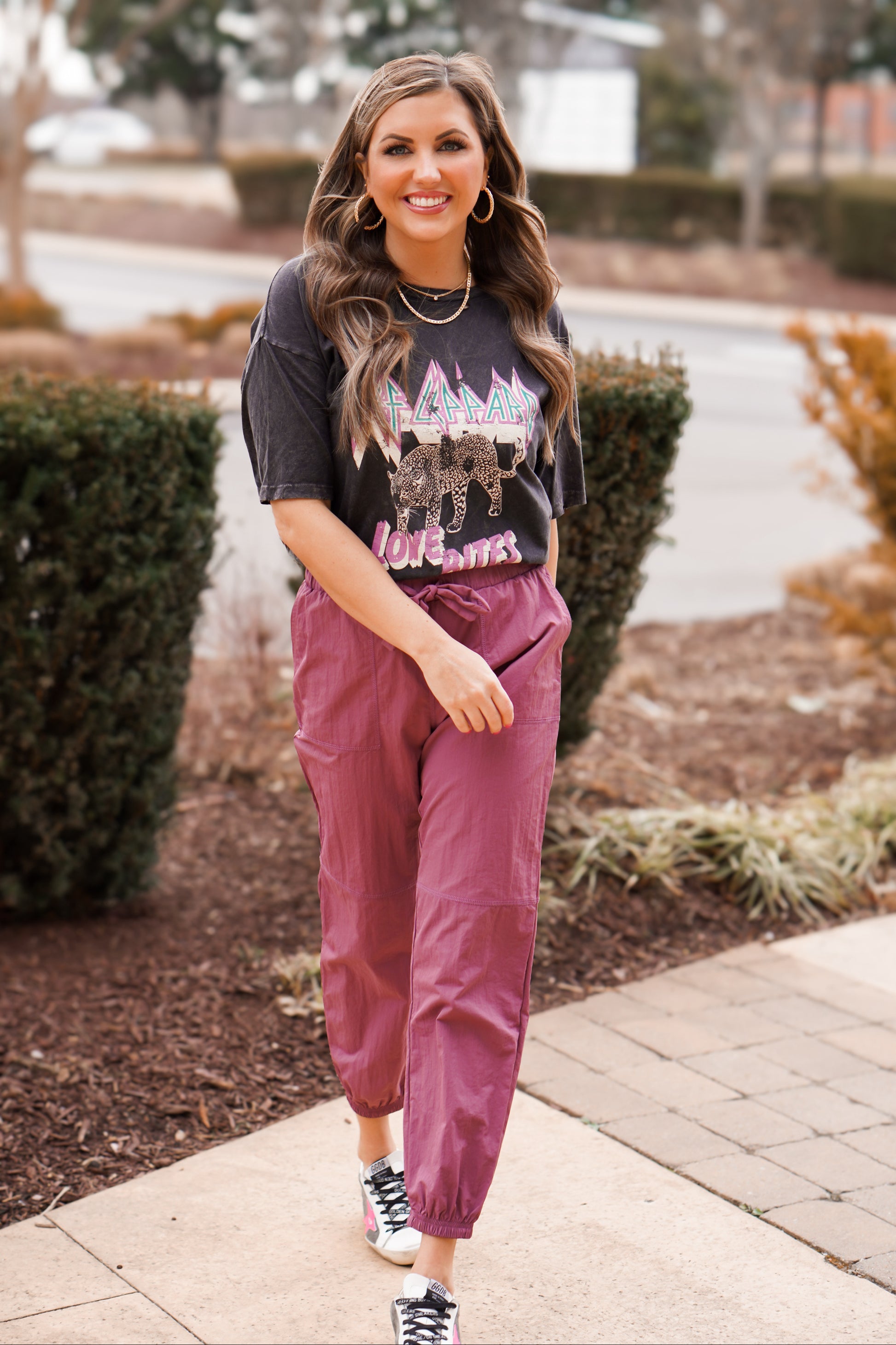 girl wearing paper bag detail joggers with graphic tee 