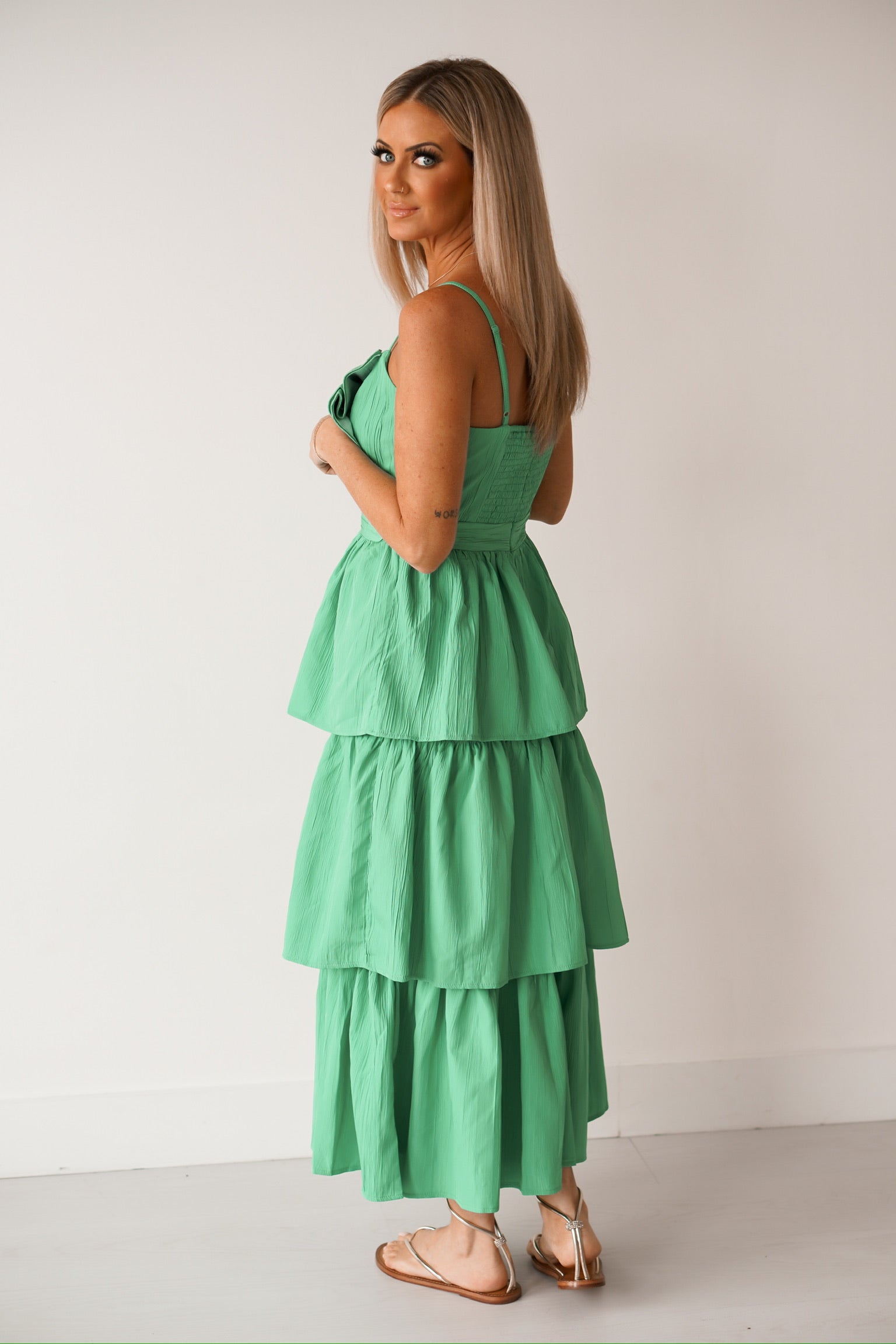 girl standing away from the camera showing off the back of the dress
