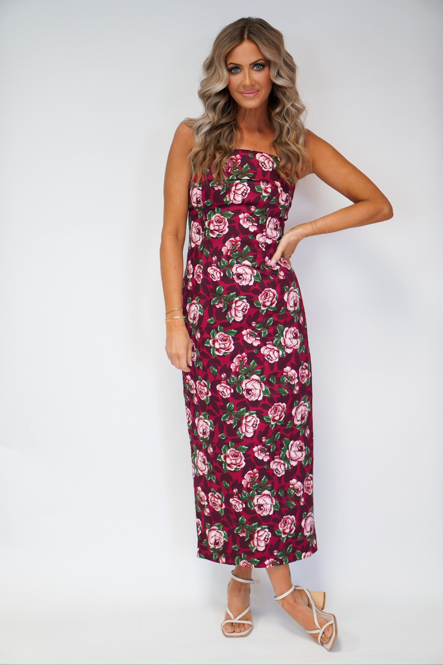 girl wearing tube dress with floral detail maxi style with hand on hip
