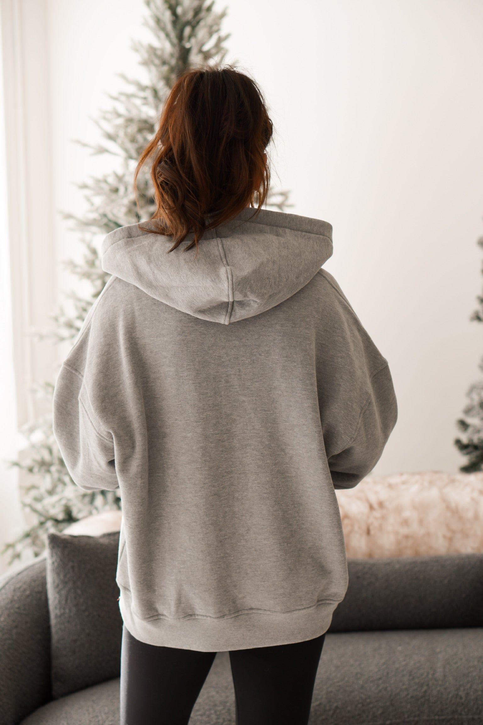back of grey zip up hoodie 