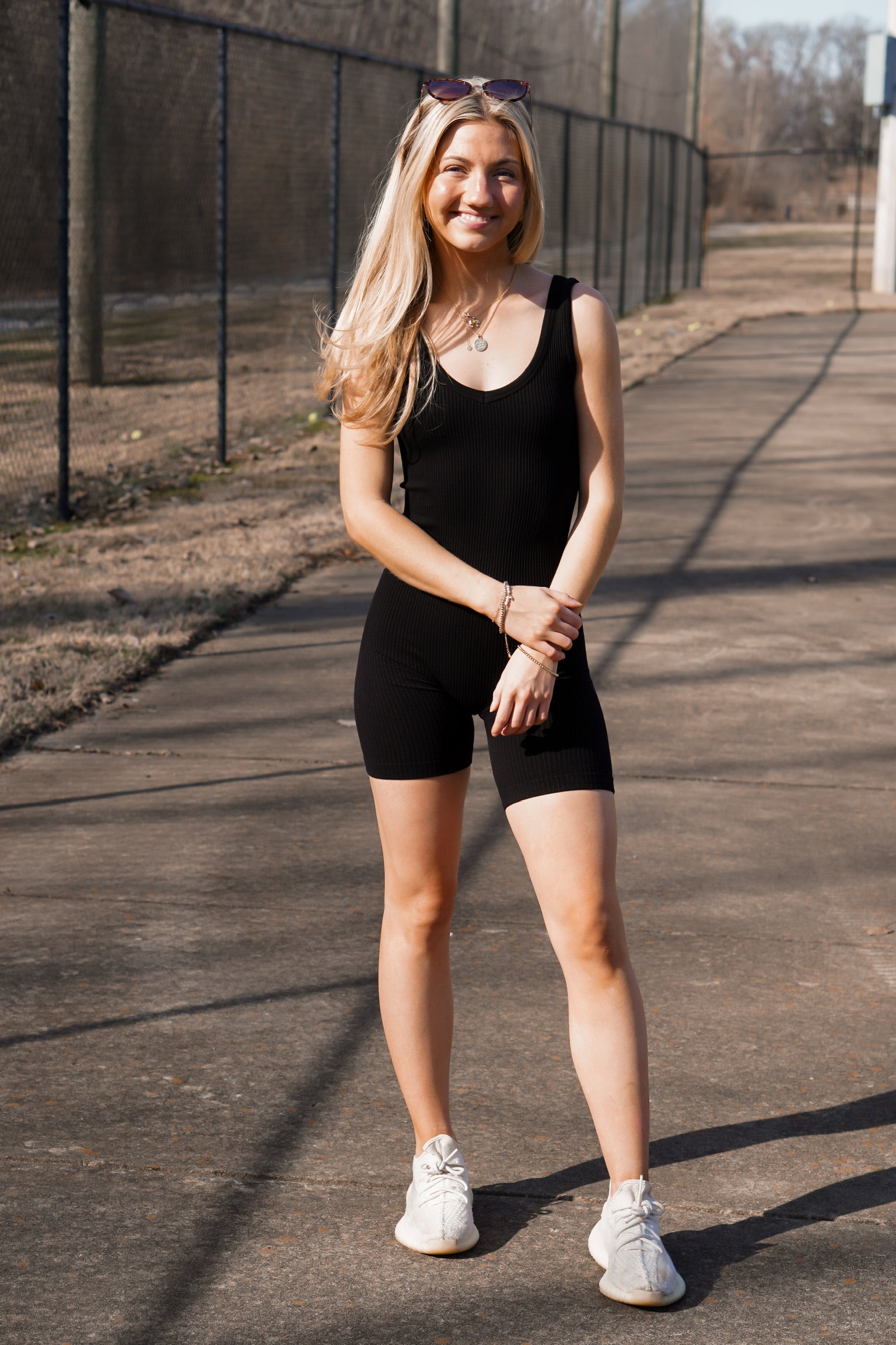 girl wearing a ribbed thick strap onesie