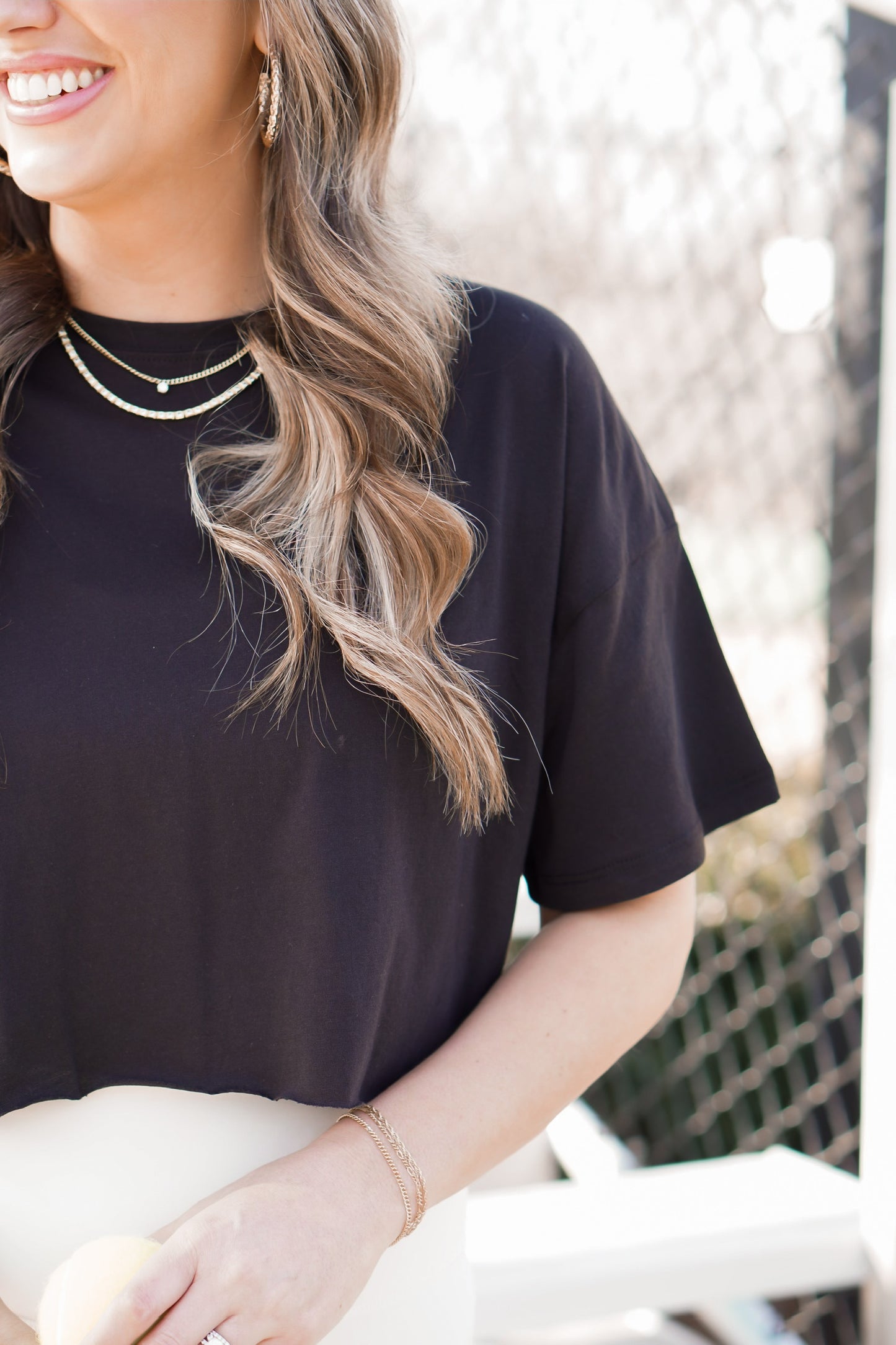 close up picture of cropped black tee 