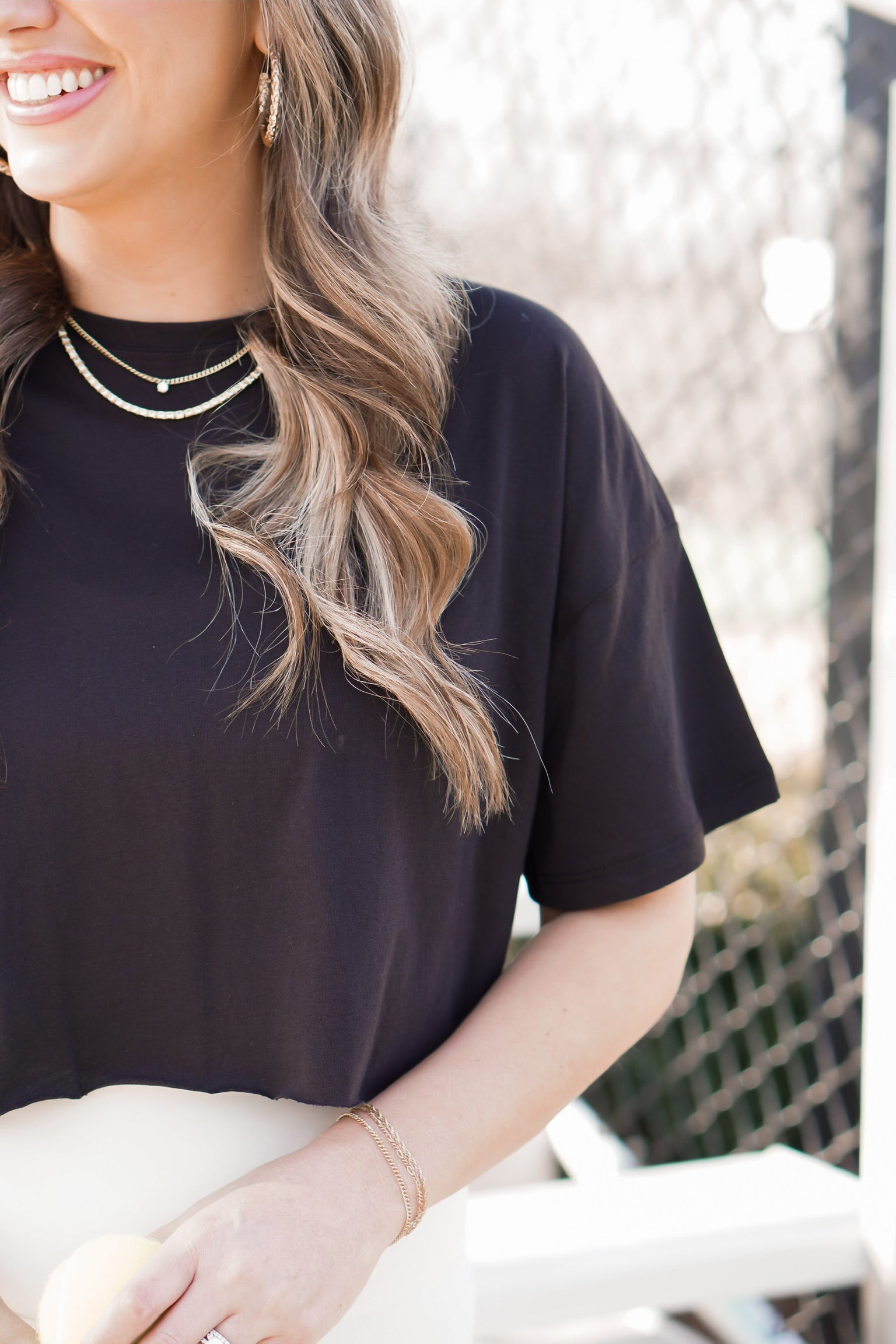 close up picture of cropped black tee 